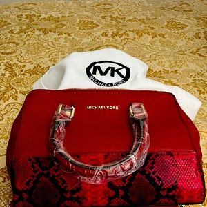 Beautiful Brand new red Michael Kors purse and purse bag.